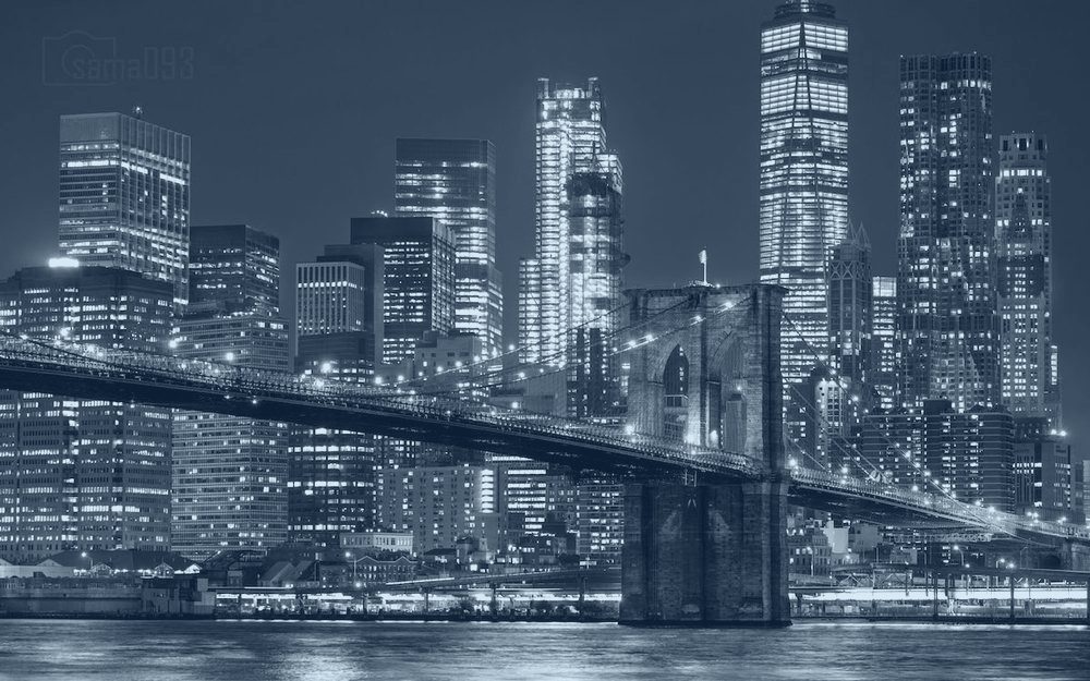 The Brooklyn Bridge and Manhattan skyline at night